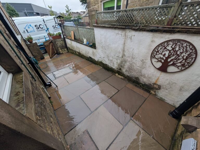 Freshly cleaned patio and stone wall in Lancashire